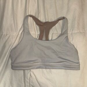 Lululemon bra. whitish grey. tan interior. size between L and XL